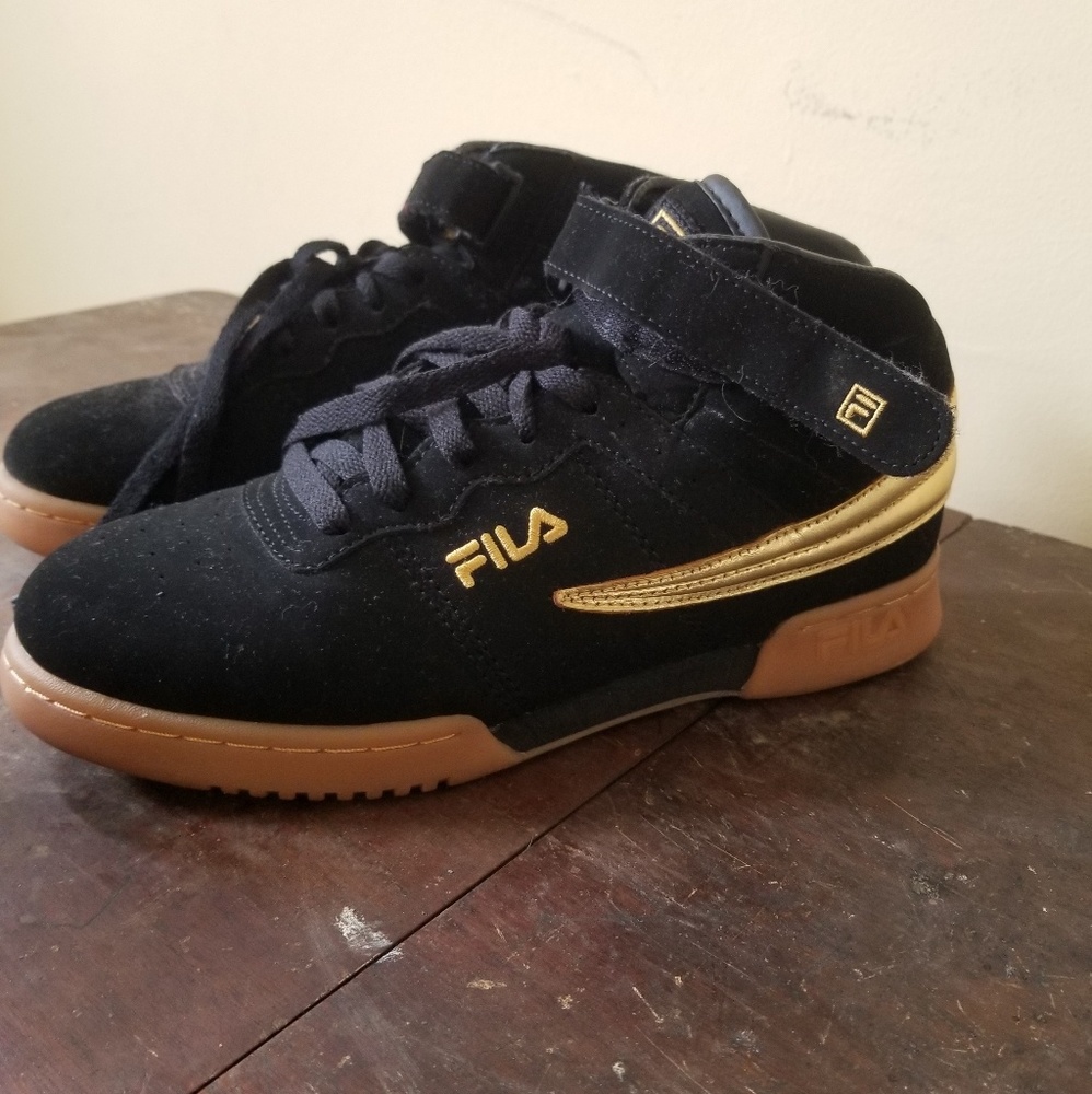 Black and gold Fila sneakers